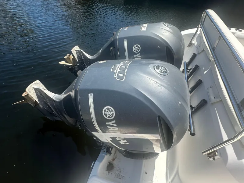 Slide: The Image of Twin Yamaha outboard motors on a 2005 Century 3200 Center Console boat. - 23