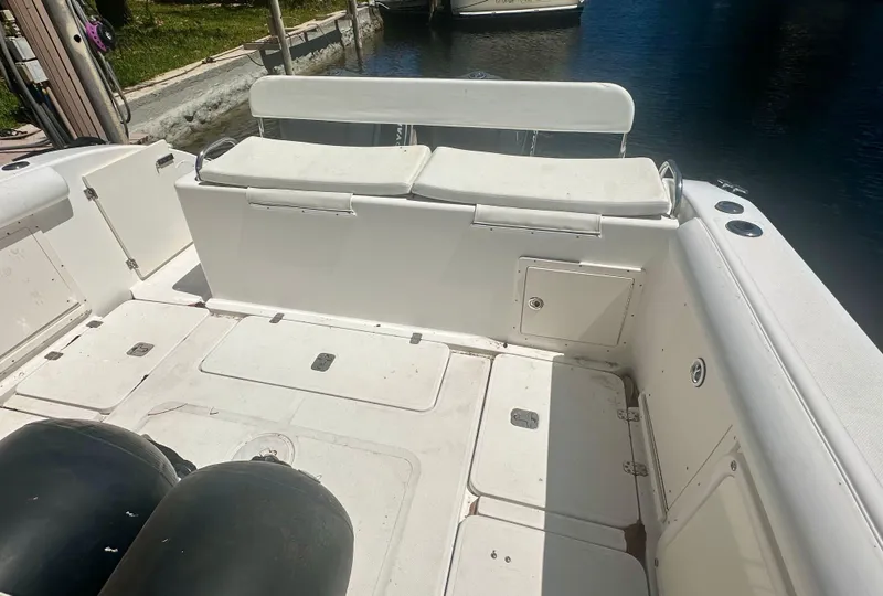 Slide: The Image of 2005 Century 3200 Center Console boat interior with seating and storage compartments. - 5