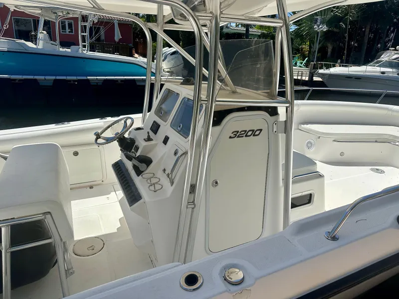 Slide: The Image of 2005 Century 3200 Center Console boat with sleek design and modern controls. - 7