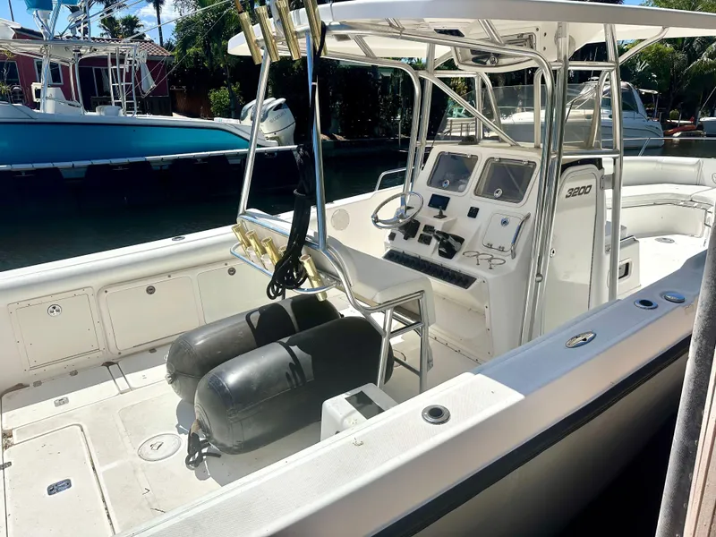 Slide: The Image of 2005 Century 3200 Center Console boat with dual seats and control panel. - 8