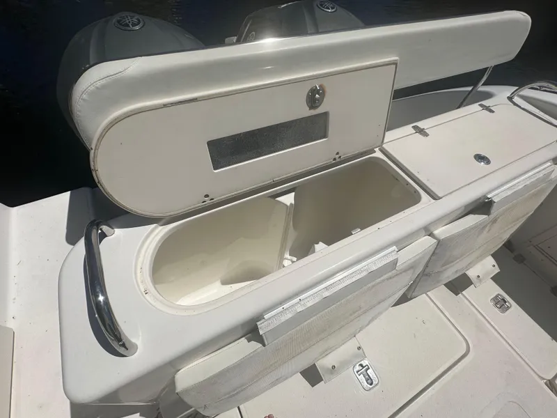 Slide: The Image of 2005 Century 3200 Center Console boat with open storage compartments. - 9