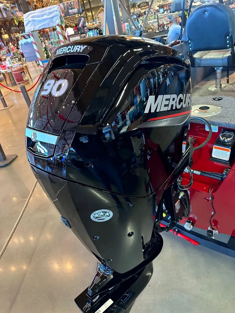 Slide: The Image of 2025 Tracker Pro Guide V-16 WT with Mercury 90 outboard motor in showroom display. - 3