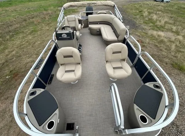 Slide: The Image of 2025 Sun Tracker Bass Buggy 18 DLX pontoon boat with spacious seating and modern design. - 9