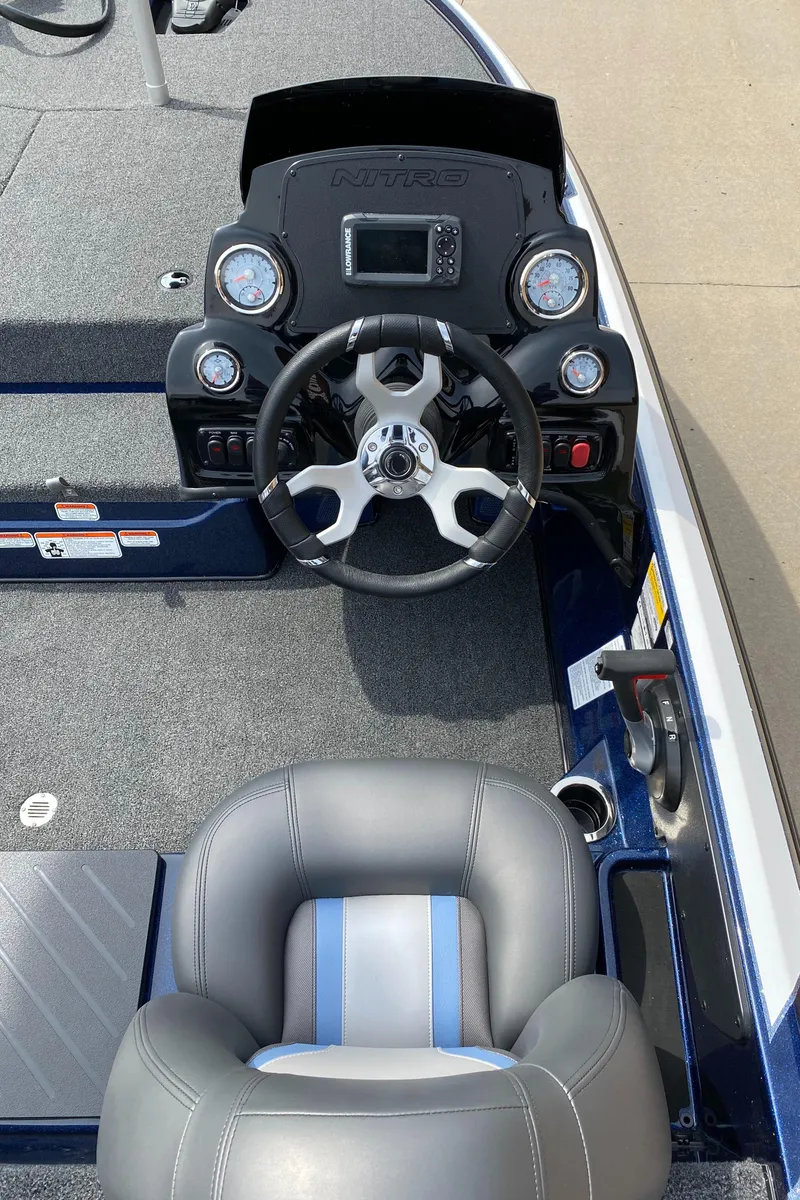 Slide: The Image of 2025 Nitro Z17 boat cockpit with steering wheel and dashboard controls. - 6