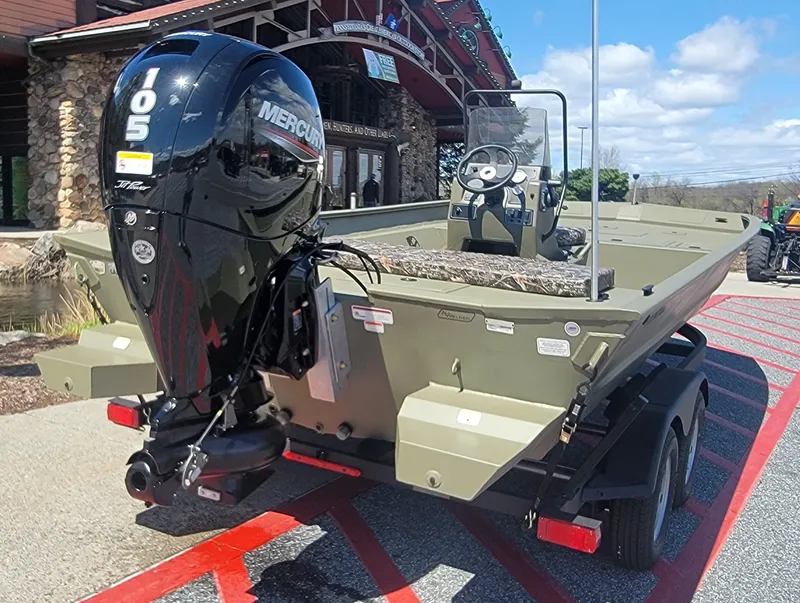 Slide: The Image of 2025 Tracker Grizzly 2072 CC boat with Mercury outboard motor on a trailer. - 2
