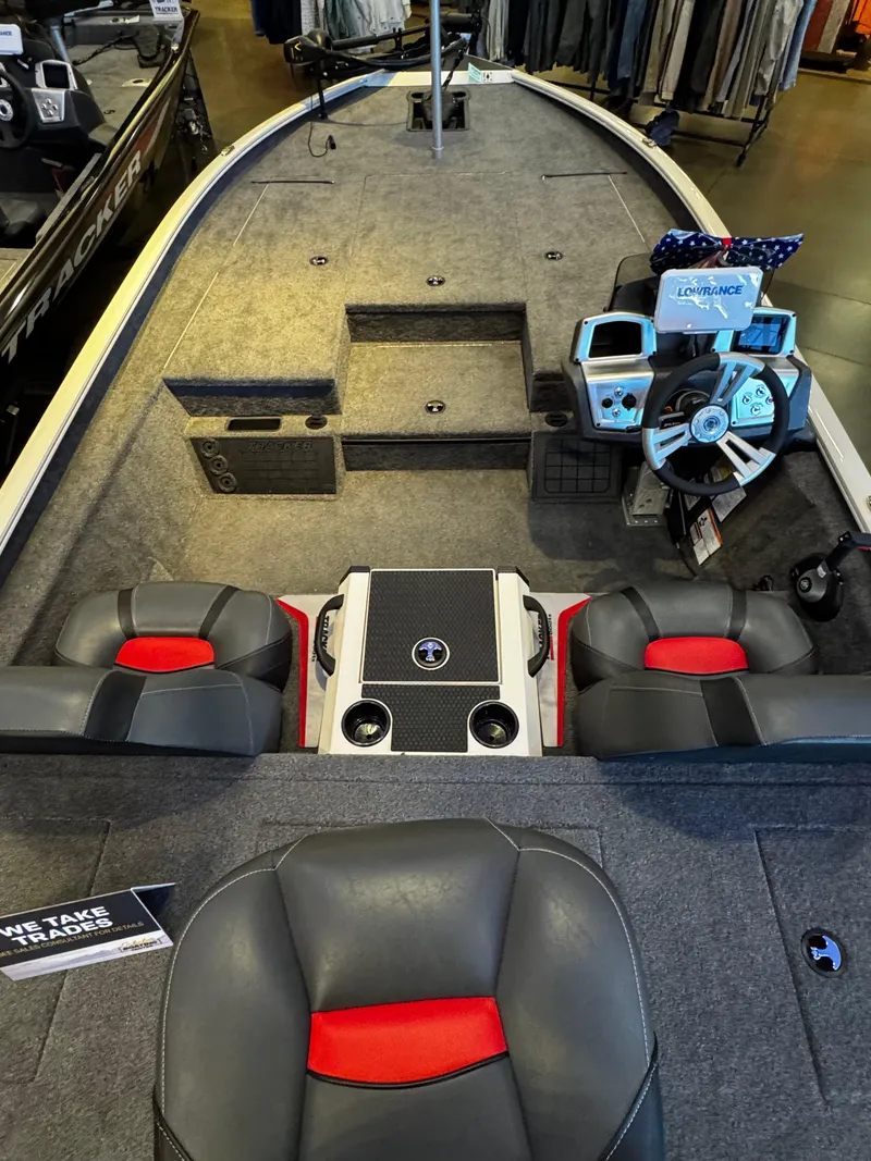 Slide: The Image of 2025 Tracker Savage 215 boat interior with seating and control panel. - 3