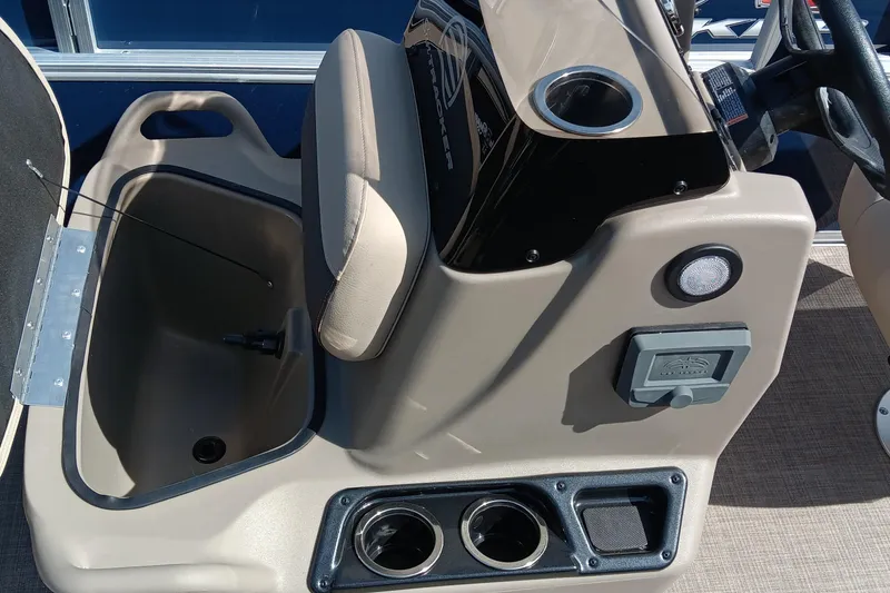 Slide: The Image of 2025 Sun Tracker Bass Buggy 16 XL Select console with storage and cup holders. - 3