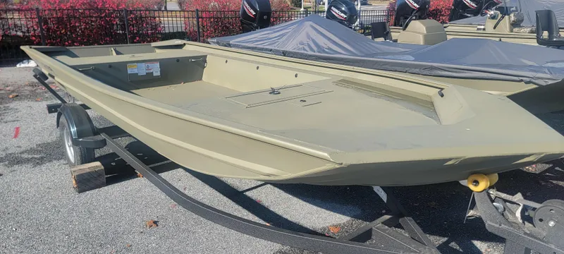 Slide: The Image of 2025 Tracker Grizzly 1754 Jon boat on trailer, parked outdoors. - 3
