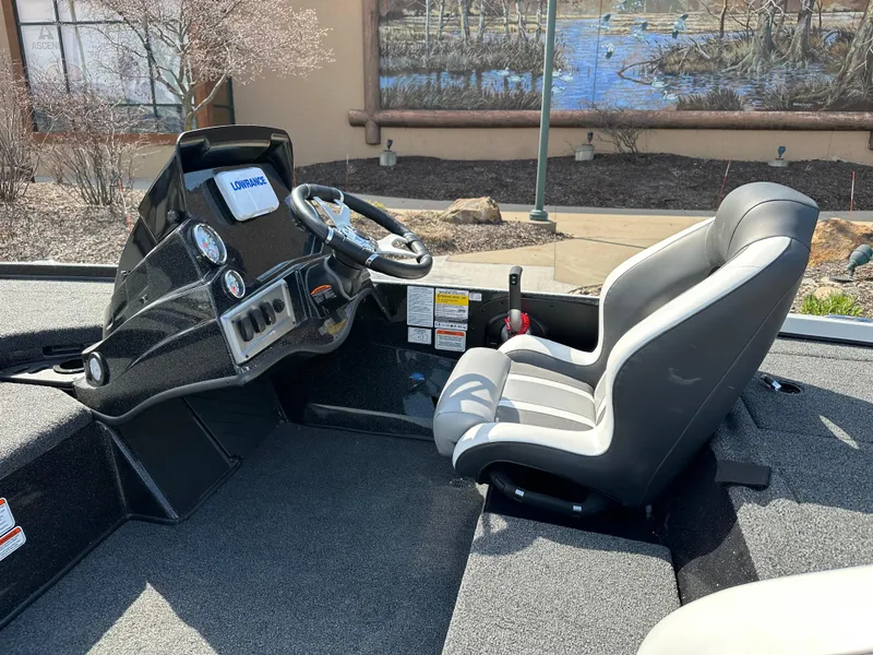 Slide: The Image of 2025 Nitro Z18 boat cockpit with steering wheel and comfortable seating. - 6