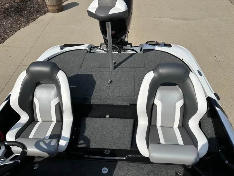 Slide: The Image of 2025 Nitro Z18 boat interior with two gray and white seats. - 8