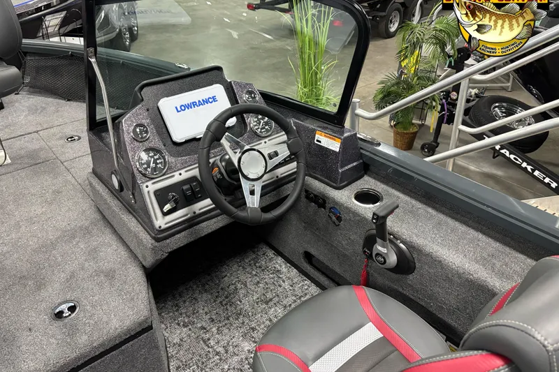 Slide: The Image of 2025 Ranger VS1882SC Reata boat interior with steering wheel and Lowrance display. - 6