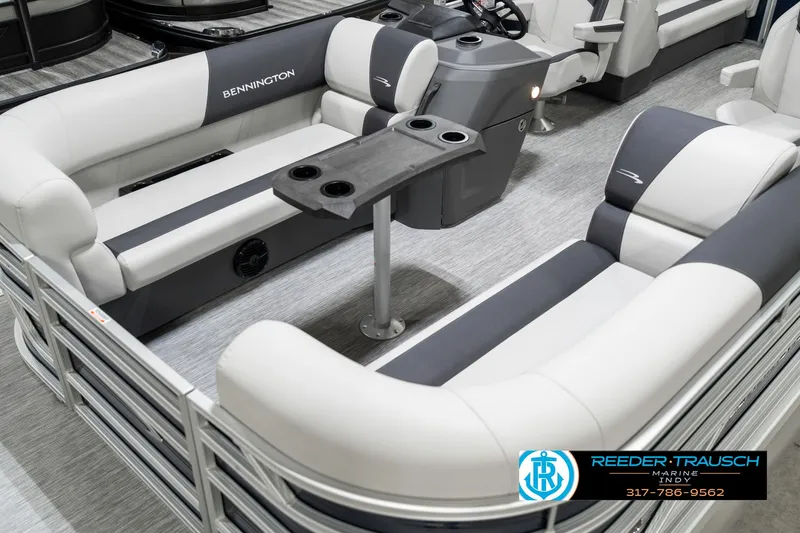 Slide: The Image of 2025 Bennington 22 SSR pontoon boat interior with gray and white seating and a central table. - 12