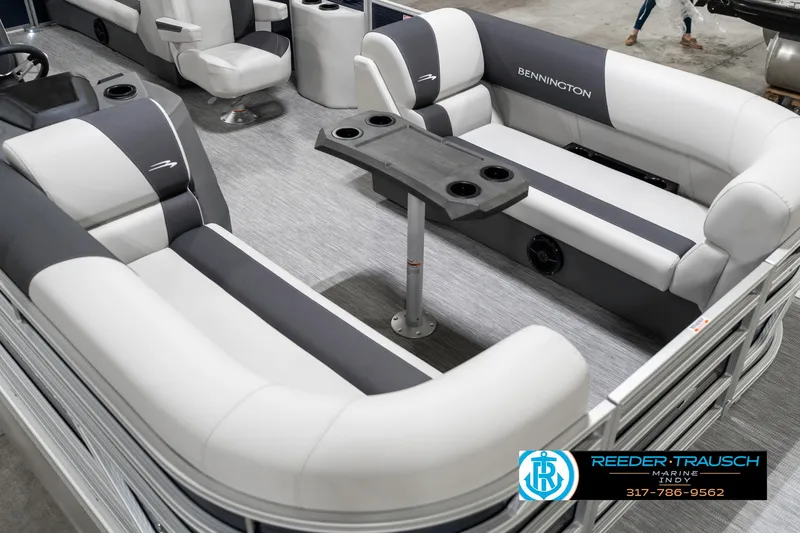 Slide: The Image of 2025 Bennington 22 SSR pontoon boat interior with gray and white seating and table. - 13