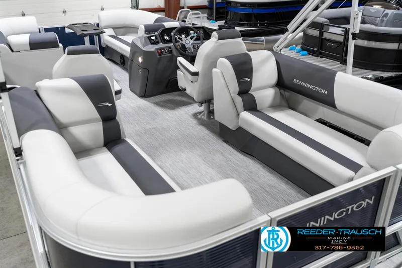 Slide: The Image of 2025 Bennington 22 SSR pontoon boat interior with luxurious seating and modern dashboard. - 15