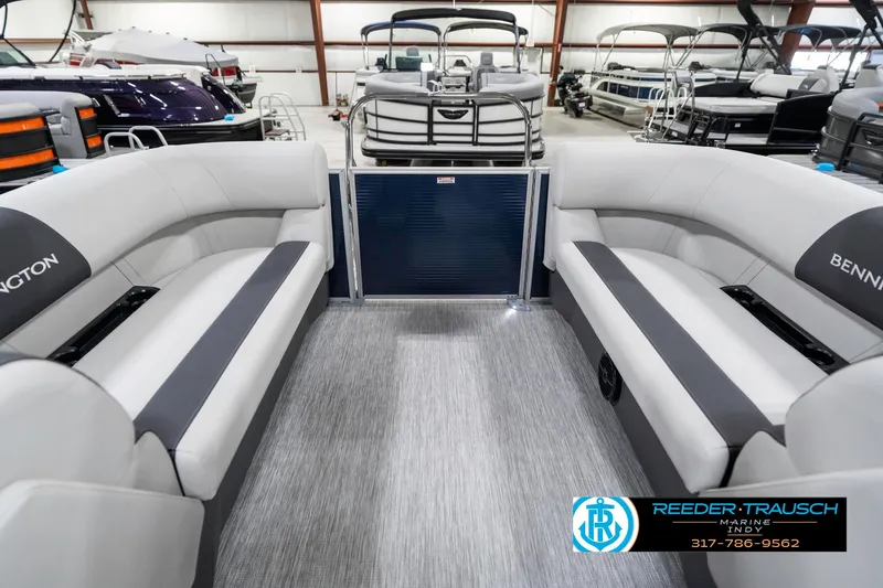 Slide: The Image of 2025 Bennington 22 SSR pontoon boat interior with gray seating in a showroom. - 18