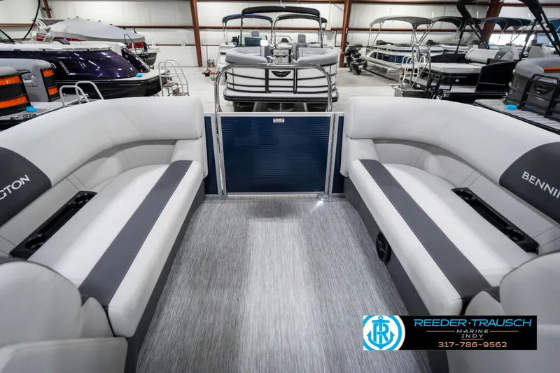 Slide: The Image of 2025 Bennington 22 SSR pontoon boat interior with gray seating in showroom. - 26