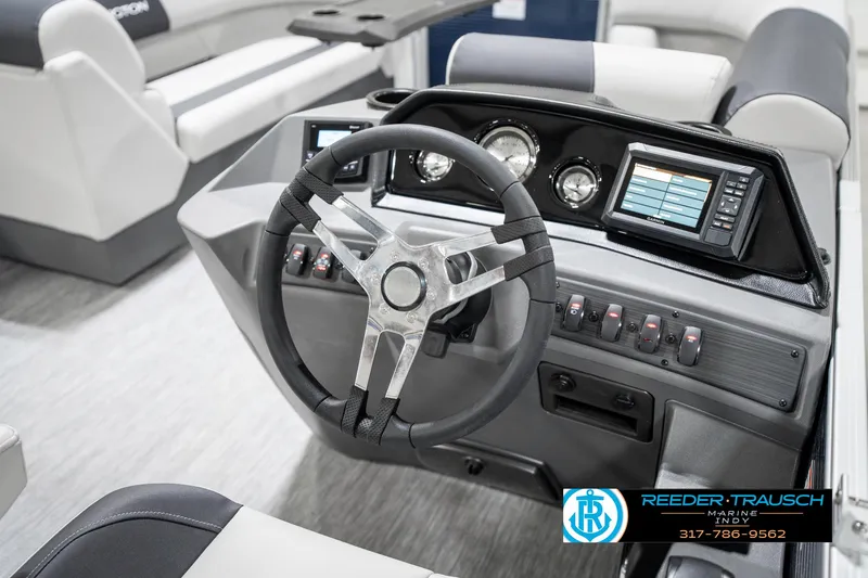 Slide: The Image of Steering console of 2025 Bennington 22 SSR pontoon boat with modern controls and dashboard. - 28