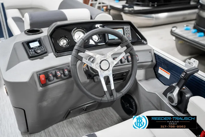 Slide: The Image of Steering console of 2025 Bennington 22 SSR boat with modern controls and dashboard. - 29