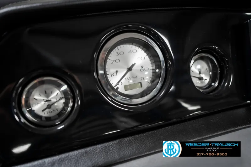 Slide: The Image of Dashboard gauges of a 2025 Bennington 22 SSR boat, featuring RPM and speed indicators. - 33