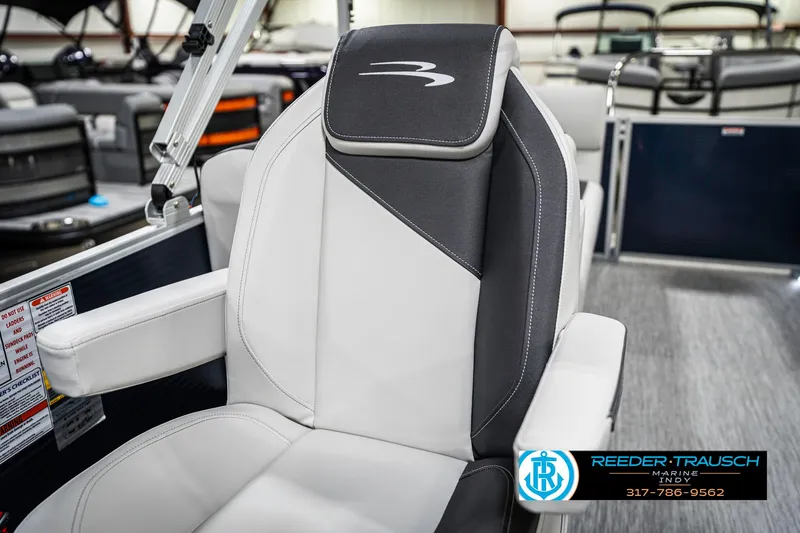Slide: The Image of 2025 Bennington 22 SSR boat seat with sleek black and white design, showcased at Reeder-Trausch Marine. - 37