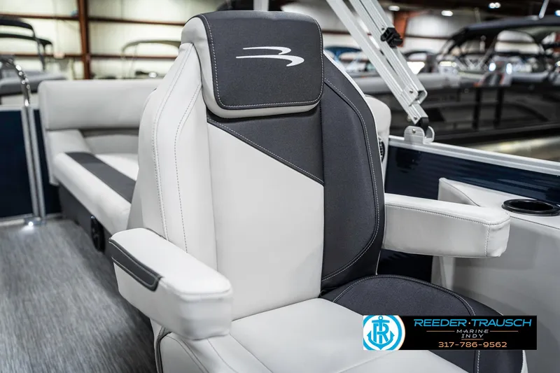 Slide: The Image of 2025 Bennington 22 SSR boat seat, luxurious design, gray and white upholstery, Reeder-Trausch logo visible. - 39