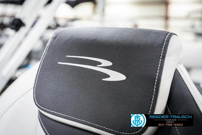 Slide: The Image of 2025 Bennington 22 SSR boat seat with logo, featuring Reeder-Trausch Marine branding. - 42