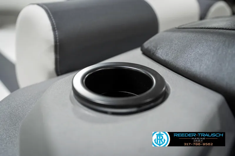 Slide: The Image of 2025 Bennington 22 SSR boat interior with cup holder and seating detail. - 44