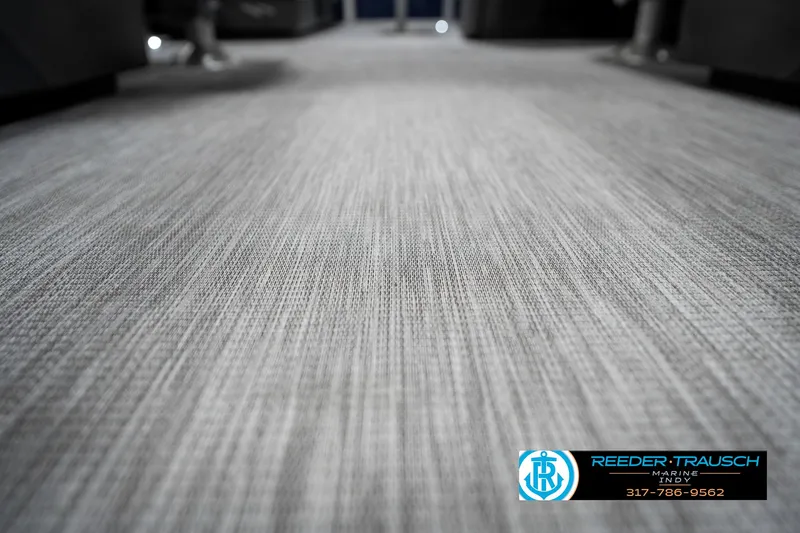 Slide: The Image of 2025 Bennington 22 SSR interior flooring, featuring textured gray carpet. - 46