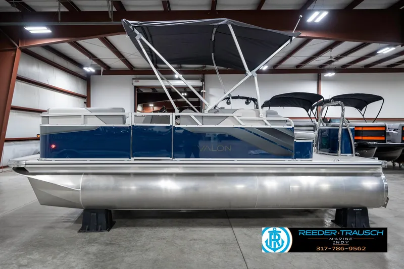 Slide: The Image of 2025 Avalon 1785 Venture CRB pontoon boat in a showroom with canopy. - 10