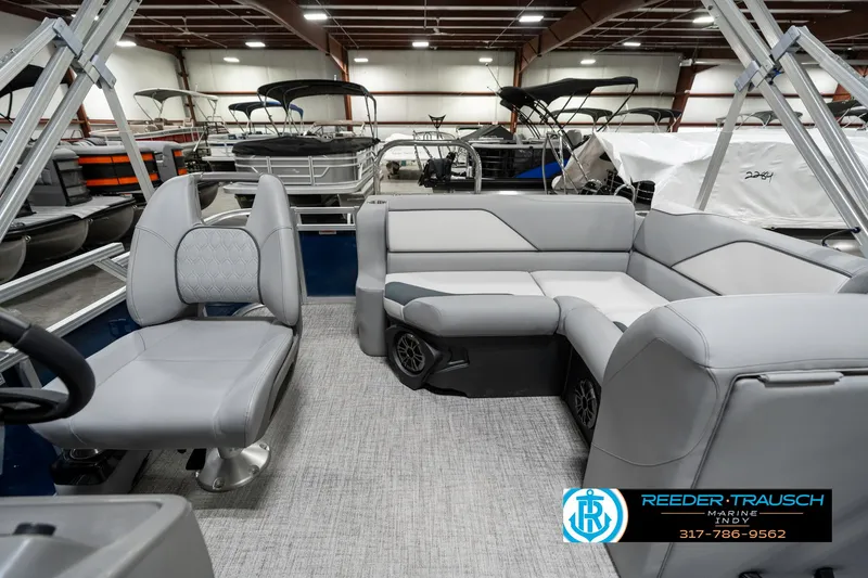 Slide: The Image of 2025 Avalon 1785 Venture CRB pontoon boat interior with gray seating in showroom. - 16
