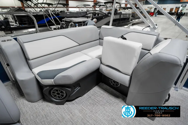 Slide: The Image of 2025 Avalon 1785 Venture CRB boat interior with gray seating and speaker system. - 25