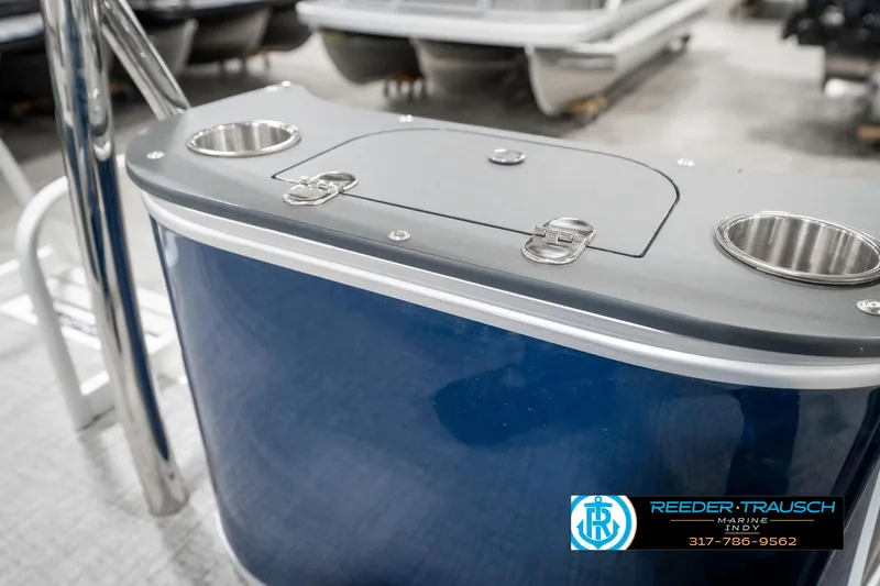 Slide: The Image of 2025 Avalon 1785 Venture CRB boat console with cup holders and storage compartment. - 28