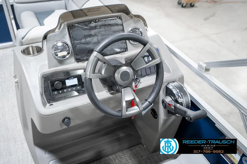 Slide: The Image of Steering console of 2025 Avalon 1785 Venture CRB boat with modern controls and dashboard. - 31