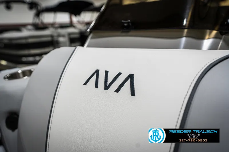 Slide: The Image of 2025 Avalon 1785 Venture CRB boat interior with logo detail, Reeder-Trausch Marine branding. - 42