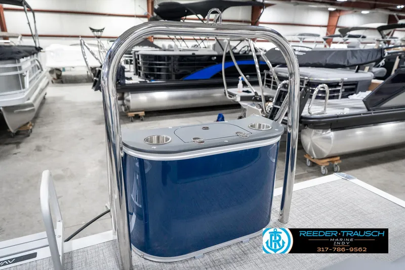 Slide: The Image of 2025 Avalon 1785 Venture CRB pontoon boat interior with blue console and cup holders. - 47