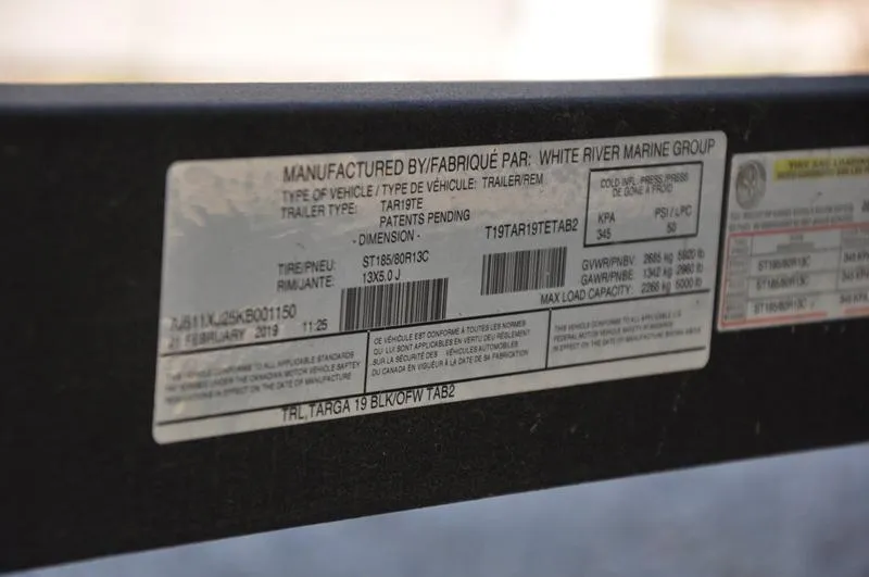 Slide: The Image of Sticker on 2019 Tracker Targa V-19 Combo Tournament Edition boat trailer. - 15