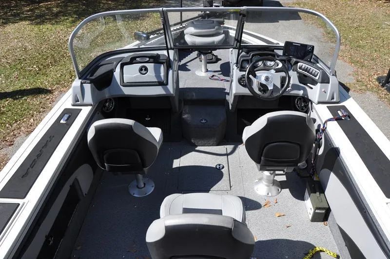 Slide: The Image of 2019 Tracker Targa V-19 Combo Tournament Edition boat interior with seating and steering console. - 8