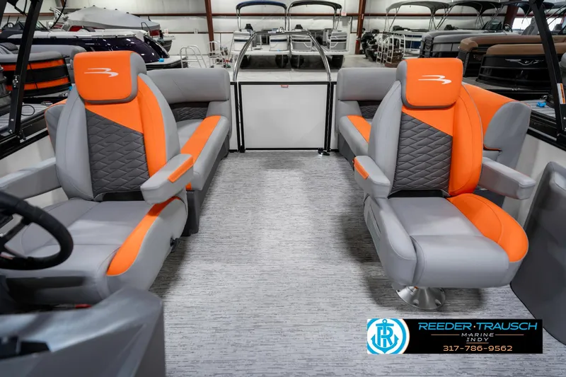 Slide: The Image of 2025 Bennington 21 SSR pontoon boat interior with orange and gray seating. - 16