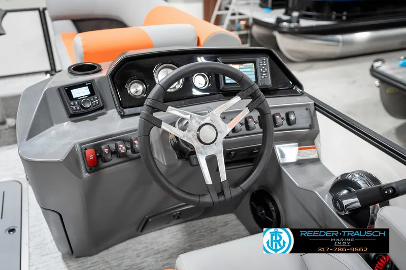 Slide: The Image of 2025 Bennington 21 SSR boat dashboard with steering wheel and control panel. - 28