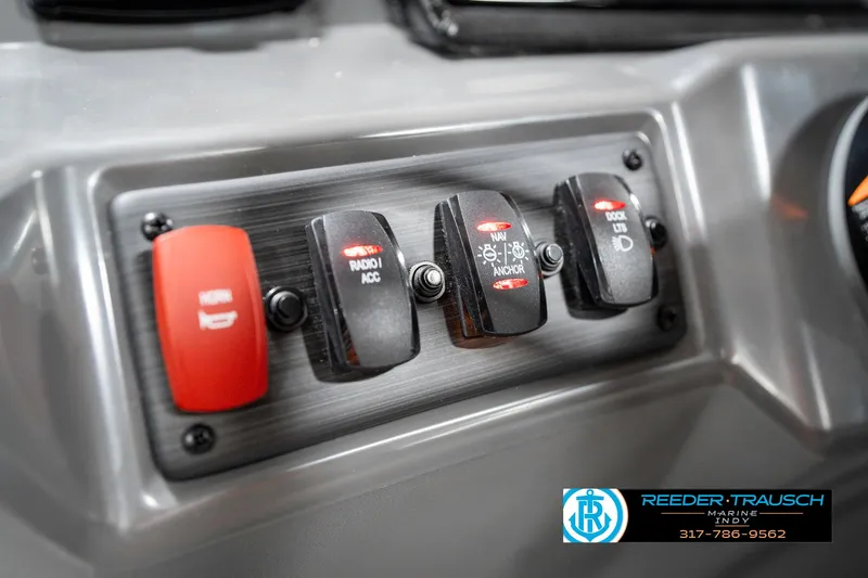 Slide: The Image of Control panel of 2025 Bennington 21 SSR boat with labeled switches. - 30