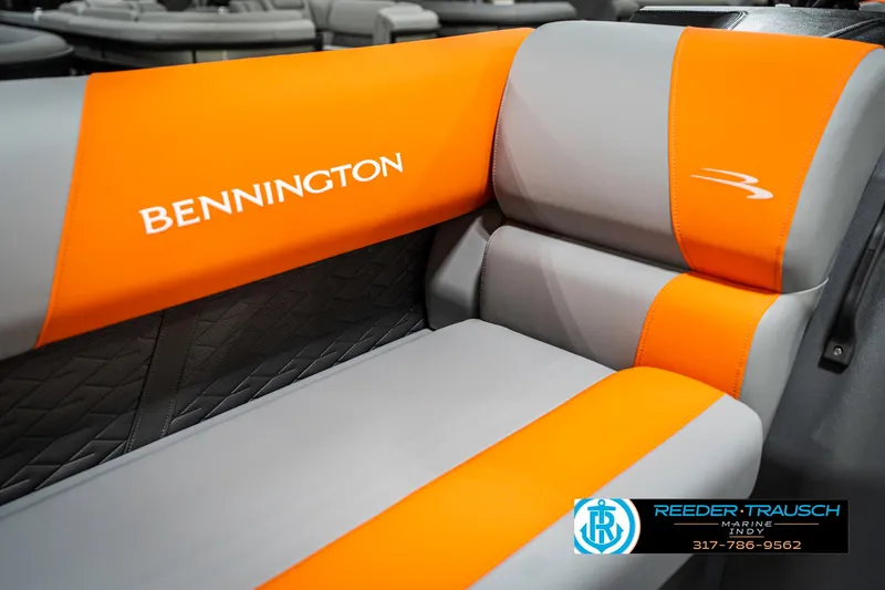 Slide: The Image of 2025 Bennington 21 SSR boat seat with orange and gray upholstery, featuring brand logo. - 37