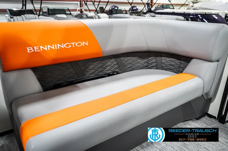 Slide: The Image of 2025 Bennington 21 SSR boat seat with orange and gray upholstery, featuring quilted backrest design. - 39