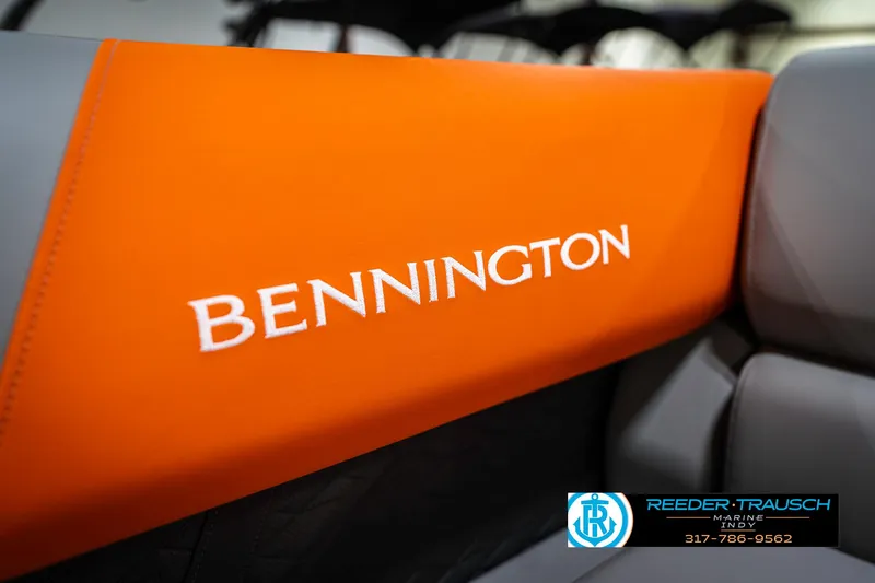 Slide: The Image of 2025 Bennington 21 SSR boat interior with orange upholstery and branding. - 40