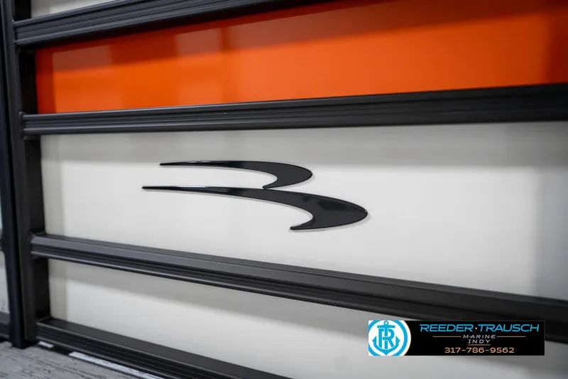 Slide: The Image of 2025 Bennington 21 SSR logo on a sleek, modern boat design with orange accents. - 46