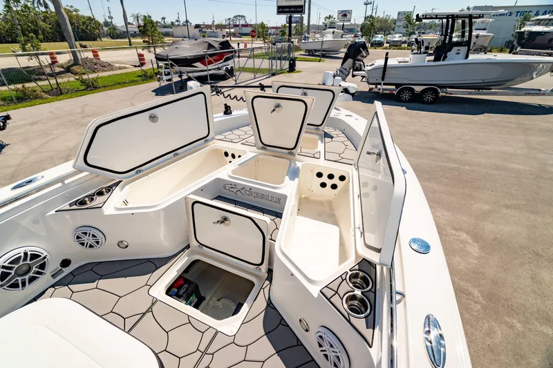 Slide: The Image of 2024 Crevalle 26 HCO boat with open storage compartments and modern deck design. - 10