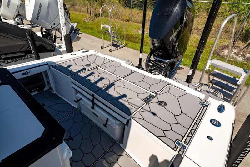 Slide: The Image of 2024 Crevalle 26 HCO boat deck with modern design and powerful outboard motor. - 11