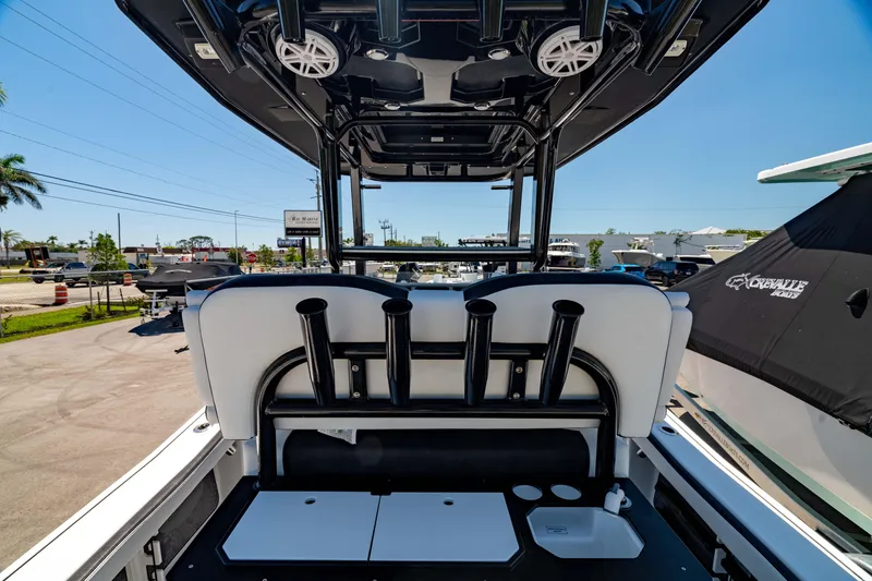 Slide: The Image of 2024 Crevalle 26 HCO boat interior with rod holders and storage compartments. - 14