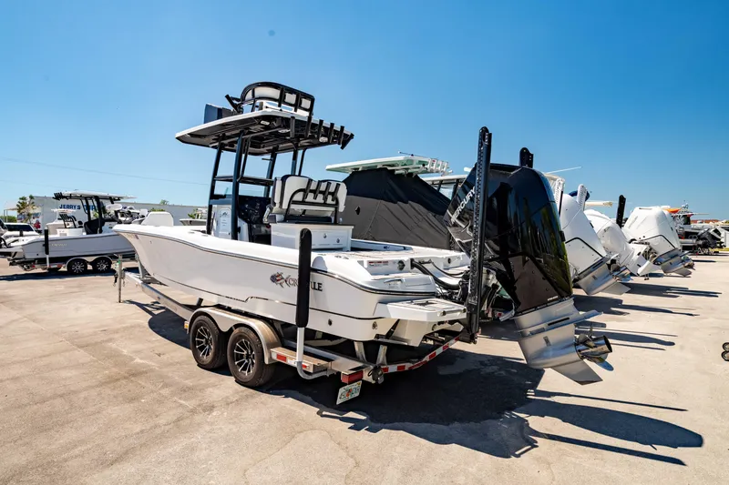 Slide: The Image of 2024 Crevalle 26 HCO boat on trailer, dual engines, outdoor display. - 15