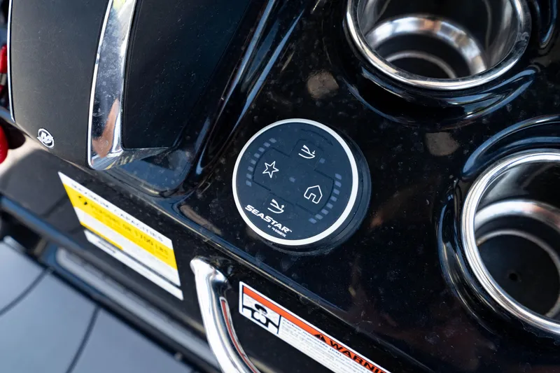 Slide: The Image of Control panel on 2024 Crevalle 26 HCO boat with SeaStar system and cup holders. - 27