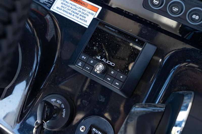 Slide: The Image of Dashboard of 2024 Crevalle 26 HCO featuring JL Audio system and ignition controls. - 30